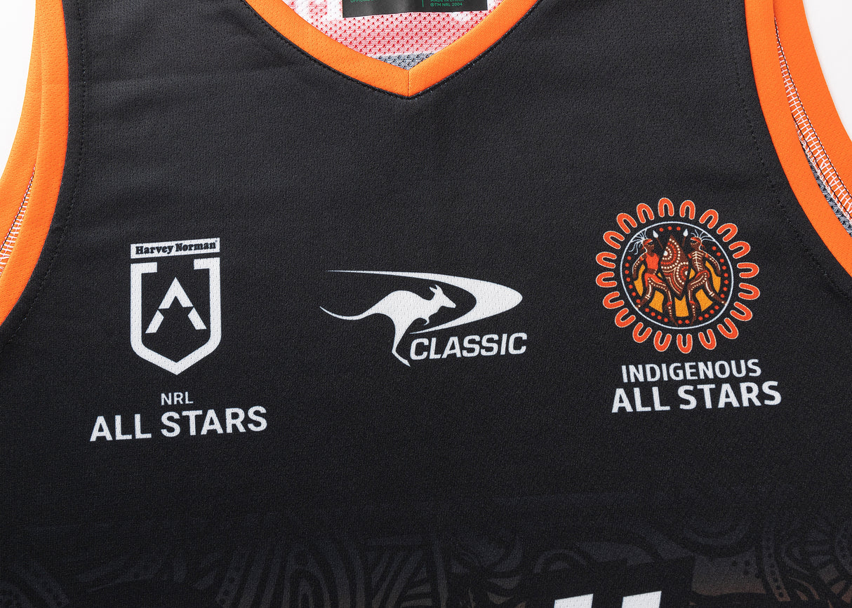 The NRL Indigenous All Stars 25/26 Pro Training Singlet by Classic Sportswear is a black sports jersey featuring "NRL All Stars," "Classic," and "Indigenous All Stars" logos, vibrant orange trim, and intricate Indigenous art design embodying the spirit of the NRL Indigenous All Stars.