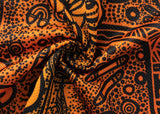 Close-up of the NRL Indigenous All Stars 25/26 Pro Training Singlet by Classic Sportswear, displaying orange and black patterned fabric with intricate abstract designs. Swirls and dots add texture, highlighting Classic Sportswear's craftsmanship.