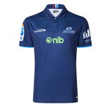 The Blues Super Rugby 25/26 Team Polo by Classic Sportswear is a blue jersey featuring short sleeves, a subtle circular pattern, and logos including "nib" and "Blues," perfect for any Blues fan.