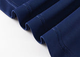 A close-up of the Blues Super Rugby 25/26 Team Polo by Classic Sportswear showcases neat, wavy pleats and visible stitching on blue fabric, reflecting a dynamic sports spirit against a pristine white background.