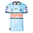 The Sharks NRL 25/26 Replica Home Jersey by Classic Sportswear features a light blue design with black and white striped sleeves, adorned with Pilot, Aramex, and Cronulla Sutherland Sharks logos. A must-have for any Sharks fan.