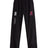 The Washington State Rugby Cuffed Hem Stadium Pant by EMB Canterbury features a white "Canterbury of New Zealand" logo and a bold red "WCU Rugby" emblem on the left side. These black pants are perfect for showcasing your sporty style with their cuffed hem design.