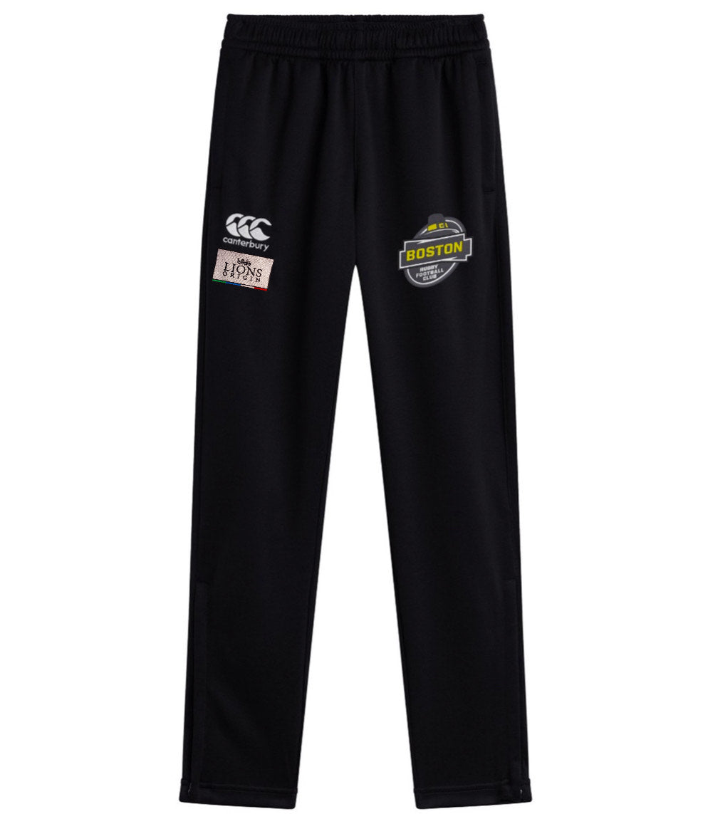 The EMB Canterbury Boston RFC Lions Origin Stretch Tapered Pant features an elastic waistband, with Canterbury, Boston, and British & Irish Lions logos on the thighs for a comfortable athletic fit.