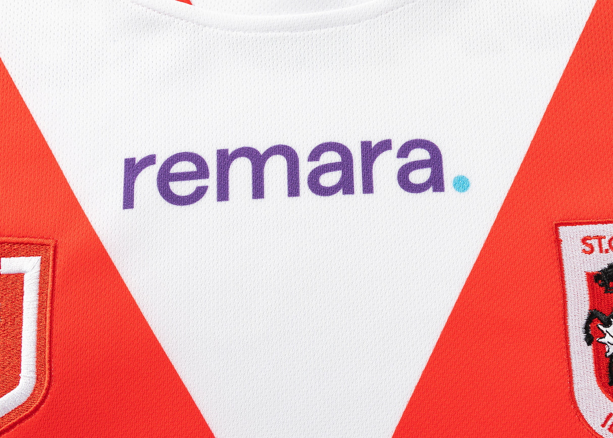 The Dragons NRL 25/26 Replica Home Jersey by Classic Sportswear is a red and white home jersey with "remara" in purple on the front.