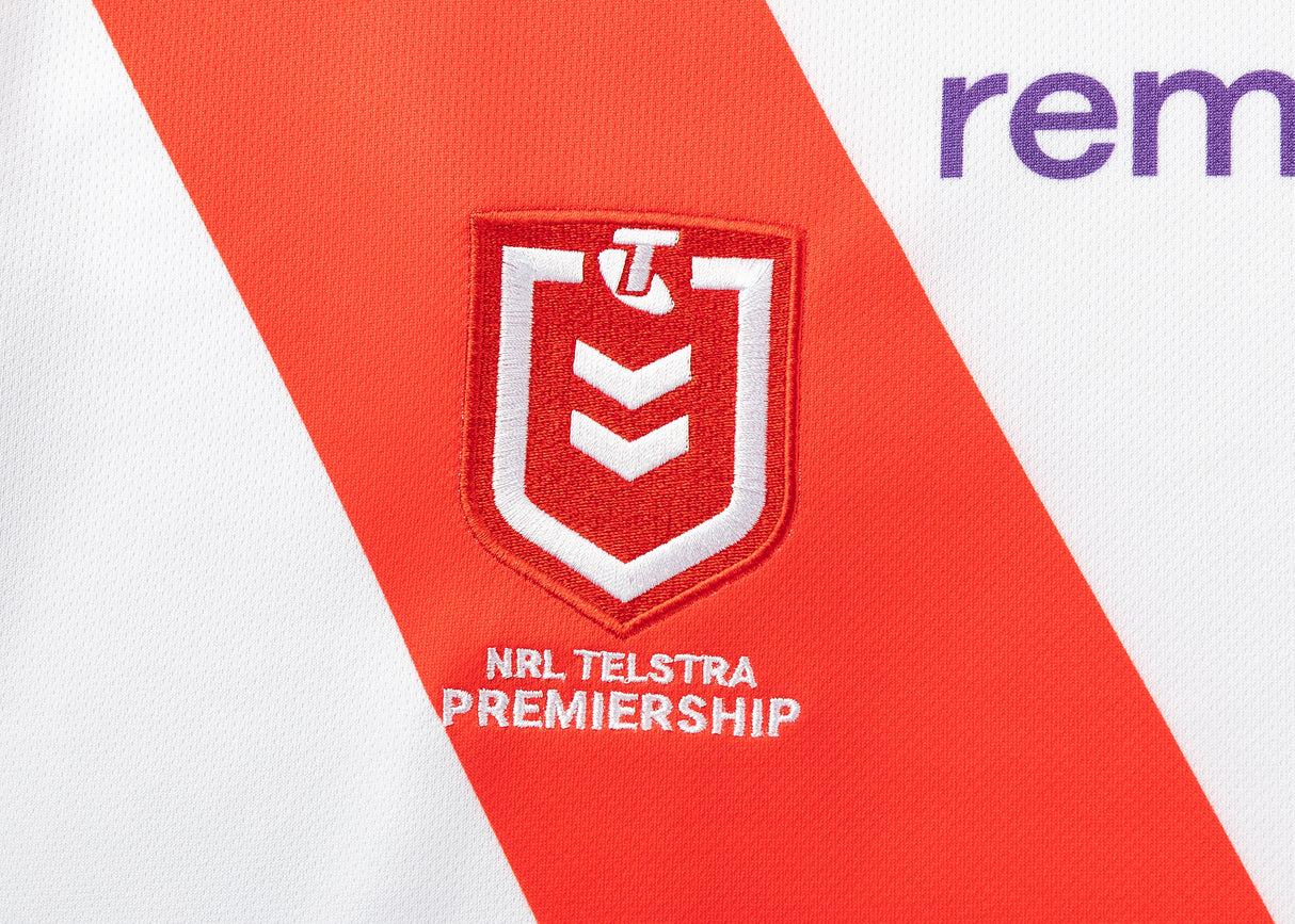 The Dragons NRL 25/26 Replica Home Jersey by Classic Sportswear showcases the iconic NRL Telstra Premiership logo on a vibrant sports jersey with a striking red diagonal stripe.