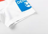 Zoom into the Dragons NRL 25/26 Replica Home Jersey by Classic Sportswear, a white classic adorned with blue and red logos, highlighted by "DEICH" in blue on the corner fabric—a tribute to Dragons NRL spirit.