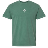The EMB S&S Activewear Ireland Vintage Comfort Tee is a green short-sleeve shirt featuring a small white floral graphic and "1875" printed on the chest.