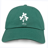 The Nations of Rugby Ireland Vintage Dad Cap by EMB S&S Activewear is a green cap with a white clover and "1875" embroidered on the front, inspired by classic vintage Irish styles.