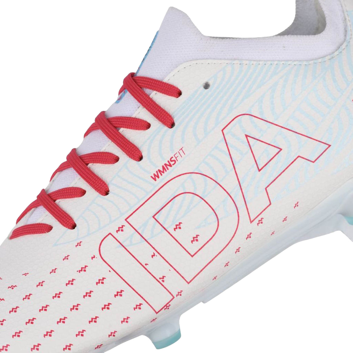 Close-up of the IDA Helia Club FG/AG Women’s Soccer Cleat by IDA Sports, featuring a white upper with red laces, blue graphic text accents, and a subtle wave pattern—an ideal choice for those seeking beginner soccer boots.