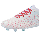 The IDA Helia Club FG/AG - White/Blue by IDA Sports are white women’s soccer cleats with red laces, red and blue text details, small red patterns, and light blue studs on the outsole—perfect beginner women’s football boots for FG/AG soccer surfaces.