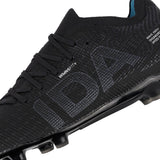 Close-up of the IDA Helia Elite FG/AG women’s soccer cleat by IDA Sports in Black/Dark Grey, featuring “IDA” in large letters on the side and textured detailing across the upper surface, highlighting its women-specific design.