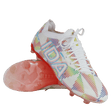A pair of IDA Sports Helia Elite Limited Edition Pride FG women's soccer cleats in white, with multicolored geometric patterns, "IDA" branding on the side, and pink-tinted translucent firm ground soles.