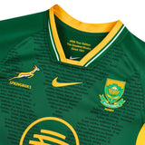 Close-up of the Springboks 26/27 RGR Replica Home Jersey by Nike in green and yellow, showcasing team and Nike logos, plus text about the 2026 Tour Edition on the inside collar—an authentic addition to any rugby rivalry jersey collection.