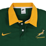 The Springboks 26/27 Classic Long Sleeve Home Jersey by Nike features a green design with a yellow collar, iconic Nike logo, and Springboks emblem—a must-have rugby shirt for South African fans.