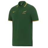 The Nike Springboks 26/27 Pique Polo is a green short-sleeve polo with yellow trim, featuring the Nike logo and Springboks emblem on the chest—ideal for South African rugby fans.