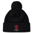 The EMB Canterbury Indiana University Women Pom Pom Beanie features a black knit design, fleece lining, a red IU logo, and "Women's Rugby Club" embroidered on the front cuff.