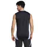A man stands with his back to the camera, wearing the All Blacks 24/25 Performance Singlet by Adidas, a sleeveless athletic shirt in black and white.