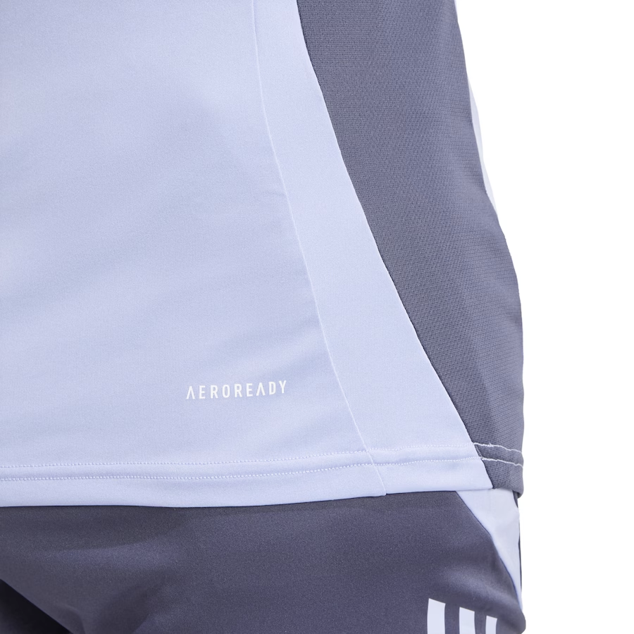 Close-up of the All Blacks 24/25 Performance Training Singlet by adidas in gray and white, featuring "Aeroready" text. Its breathable fabric and diagonal color blocking capture an athletic essence reminiscent of the All Blacks spirit.