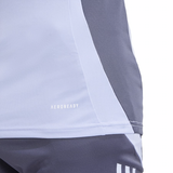 Close-up of the All Blacks 24/25 Performance Training Singlet by adidas in gray and white, featuring "Aeroready" text. Its breathable fabric and diagonal color blocking capture an athletic essence reminiscent of the All Blacks spirit.