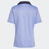 Viewed from the back against a plain backdrop, the All Blacks 24/25 Training Jersey by adidas is a light blue short-sleeve polo with a dark collar and subtle silver fern logo.