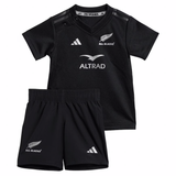 The adidas Infant All Blacks 24/25 Home Kit includes a V-neck jersey and shorts with silver accents, featuring AEROREADY Technology for comfort.