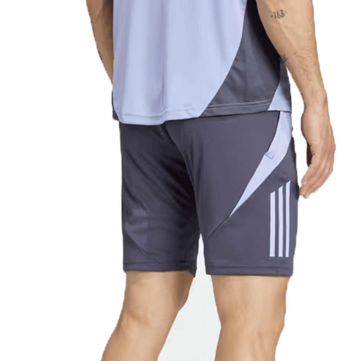 A person wearing a two-tone athletic outfit with All Blacks 24/25 Performance Gym Shorts by adidas, made from recycled materials and a light top, viewed from the back.