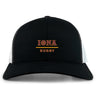 The EMB S&S Activewear Iona College Retro Trucker Cap features a black and white design with "IONA RUGBY" in yellow and red on the front, plus a classic snapback closure for adjustable comfort.