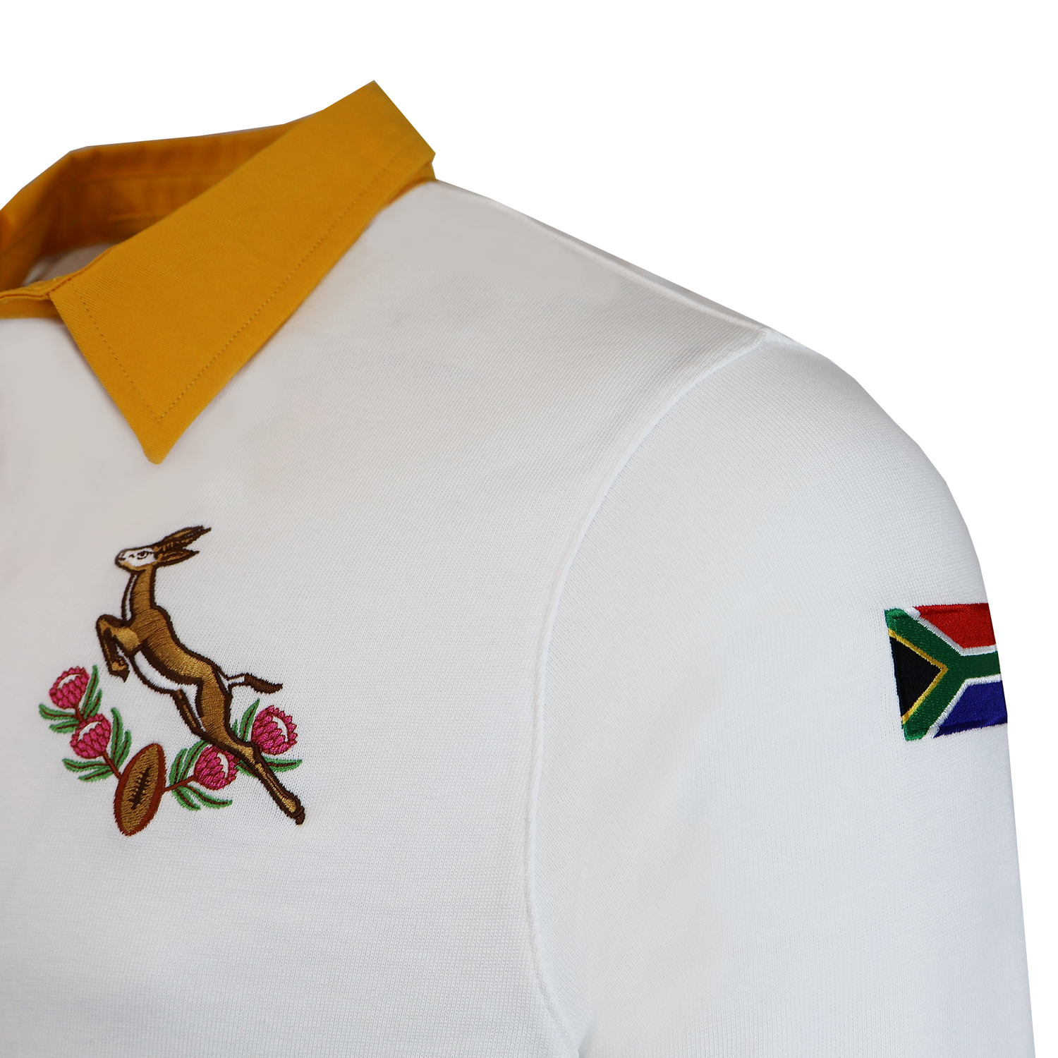 The Nike Springboks Heritage Long Sleeve Rugby Jersey features a white design with yellow collar, Springboks and protea emblems on the chest, and a South African flag patch on the sleeve.