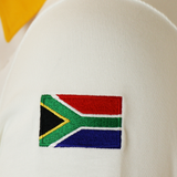 A close-up of a South African flag patch embroidered on the Nike Springboks Heritage Long Sleeve Rugby Jersey, showcasing team pride.