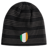 The EMB Canterbury Ireland Shield Beanie is a black, striped beanie featuring an embroidered emblem with green, white, and orange vertical stripes.