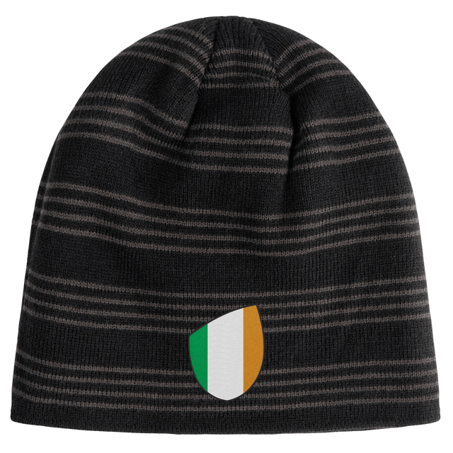 The EMB Canterbury Ireland Shield Beanie is a black, striped beanie featuring an embroidered emblem with green, white, and orange vertical stripes.