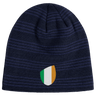 An Ireland Shield Beanie from EMB Canterbury, featuring navy blue stripes and an emblem with green, white, and orange vertical stripes.