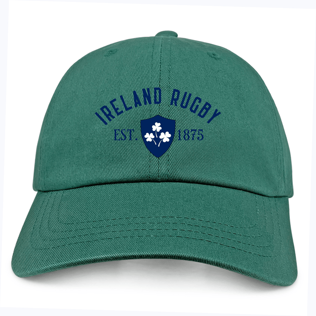 The EMB S&S Activewear Ireland Rugby 1875 Navy Logo Dad Cap is made from Cotton Twill and features "Ireland Rugby Est. 1875" with a blue shamrock logo embroidered on the front.