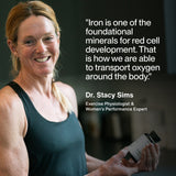 A woman in athletic wear smiles, holding a bottle of Momentous Iron+. Beside her is a quote from Dr. Stacy Sims, Exercise Physiologist, about iron’s crucial role in oxygen transport and energy support.