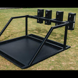 The IronBack Gorilla 8 Man Scrum Machine, a metal training device with padded shields for rugby scrum practice, is positioned on a grassy field.