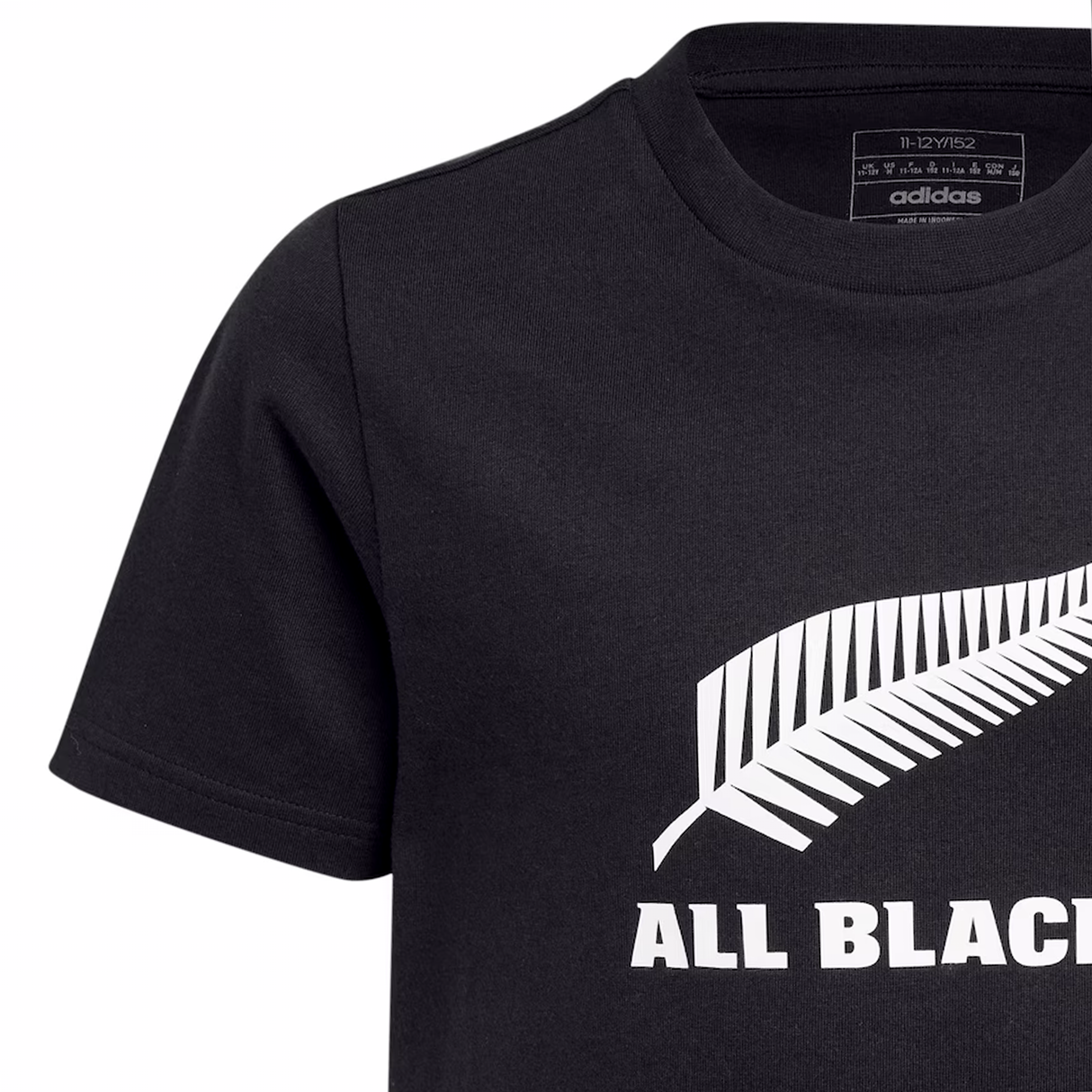 The All Blacks Logo Tee by adidas is a black T-shirt adorned with a silver fern graphic and bold "ALL BLACKS" text. The iconic adidas logo on the collar pays homage to New Zealand's legendary rugby team.