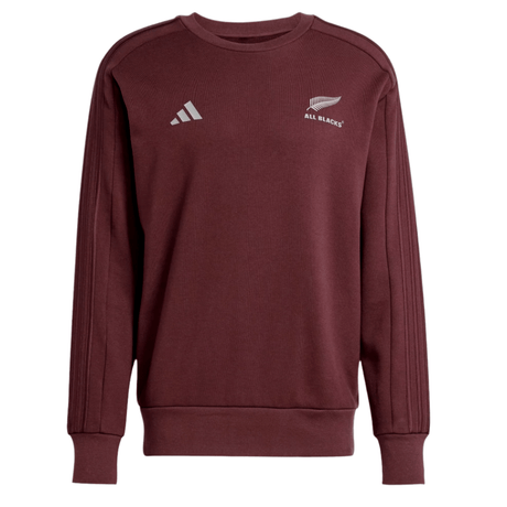 The All Blacks 24/25 Fan Crewneck Sweatshirt by adidas is maroon with a white fern leaf logo on the right chest and the adidas logo with signature 3-Stripes on the left, capturing the All Blacks' spirit.