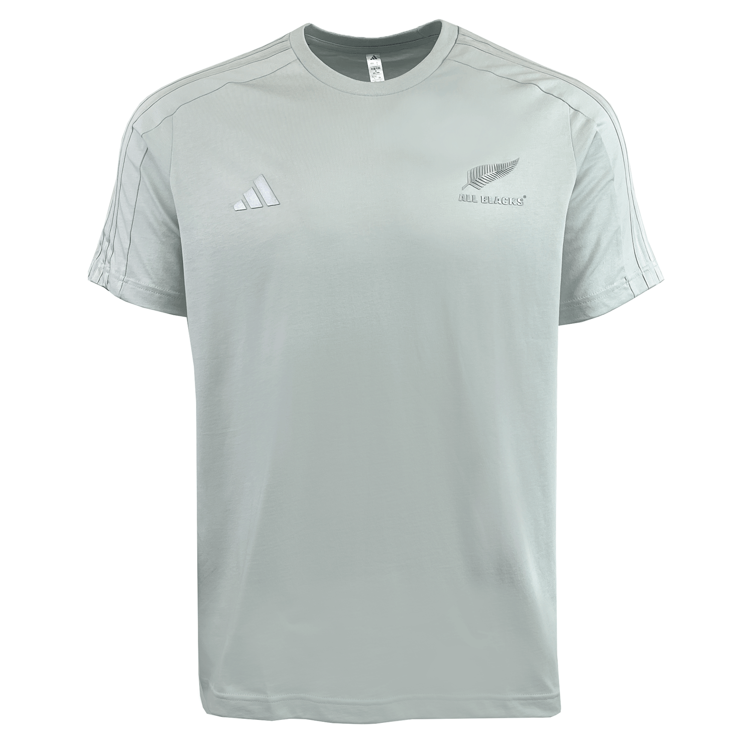 This light gray All Blacks 24/25 Fan Tee by adidas, crafted in breathable jersey fabric, sports the iconic Adidas logo on the left and a silver fern with "All Blacks" text on the right.