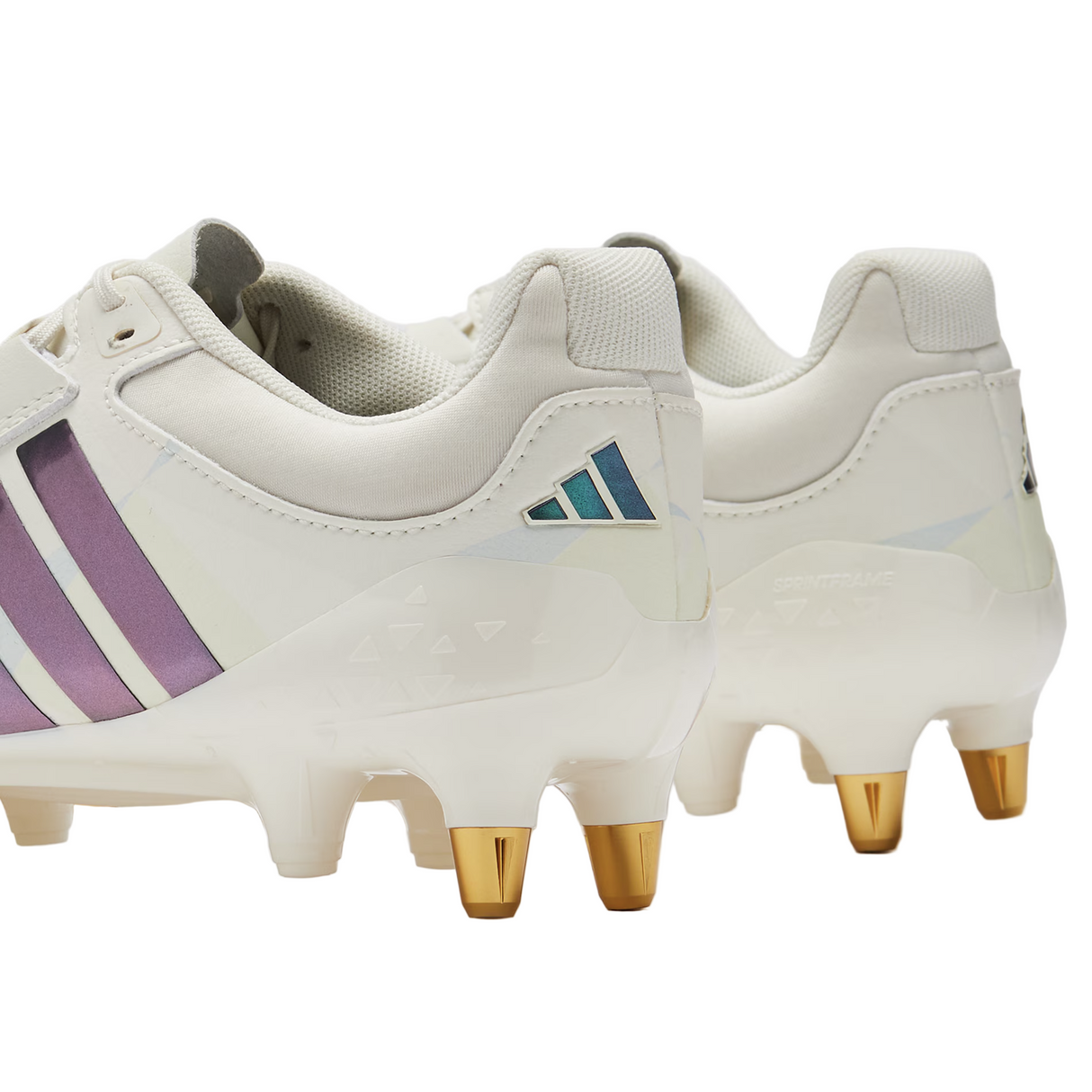 A pair of adidas Women's RS15 Avaglide SG rugby boots in Off White/Grey Five, designed for soft ground, shown from the back and side.
