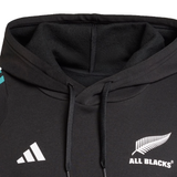 Close-up of the adidas All Blacks 25/26 Training Hoodie, showcasing the iconic silver fern and adidas logos—a must-have for any rugby fan.