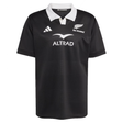 The All Blacks 25/26 Replica Home Jersey by adidas is a black short-sleeve jersey made from recycled polyester, featuring a white collar, adidas logo, silver fern All Blacks logo, and "ALTRAD" sponsor text on the chest.