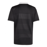 Back view of the adidas All Blacks 25/26 Replica Home Jersey, a short-sleeve black sports shirt with subtle horizontal stripes and a white collar, made from recycled polyester, shown against a plain white background.