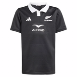 The Youth All Blacks 25/26 Replica Home Jersey by adidas features a black short-sleeve design with a white collar, adidas logo, and ALTRAD sponsor branding—perfect for young fans supporting their team.