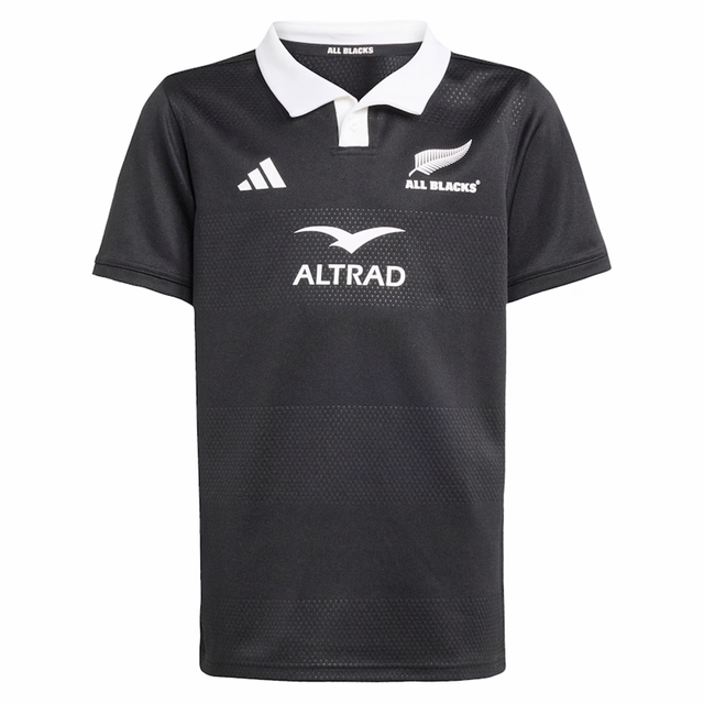 The Youth All Blacks 25/26 Replica Home Jersey by adidas features a black short-sleeve design with a white collar, adidas logo, and ALTRAD sponsor branding—perfect for young fans supporting their team.