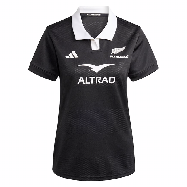 Show your support with the Women's All Blacks 25/26 Replica Home Jersey by adidas—featuring a white collar, team and adidas logos, plus "ALTRAD" sponsor text. The perfect black rugby shirt for passionate fans.