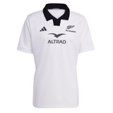 The adidas All Blacks 25/26 Replica Away Jersey features a white design with a black collar, team and sponsor logos, and adidas branding—ideal as an official All Blacks away rugby jersey.