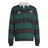 The All Blacks 25/26 Long Sleeve Heritage Polo by adidas features dark green and black stripes, a white collar, and adidas and All Blacks logos, blending classic rugby style with adidas heritage details.