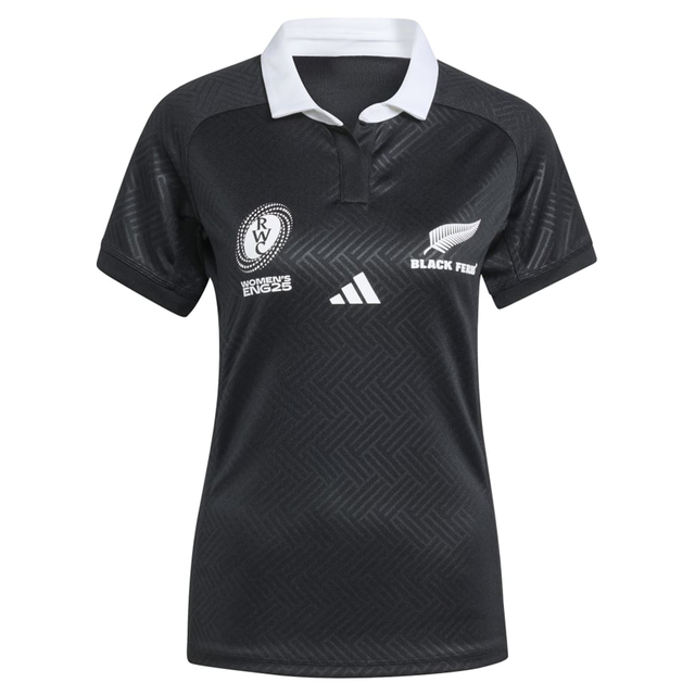 The Women's Black Ferns WRWC25 Replica Home Jersey by adidas features a white collar and displays the Women's Rugby World Cup and Black Ferns logos on the chest—a perfect replica for fans.