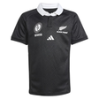 The Black Ferns WRWC25 Replica Home Jersey by adidas is a black short-sleeved rugby shirt with a white collar, chest logos including the Black Ferns and adidas emblems, plus two additional white emblems.