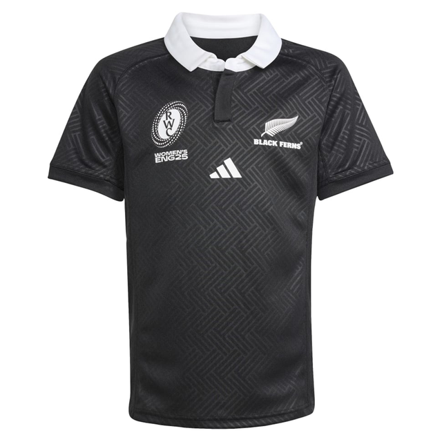 The Black Ferns WRWC25 Replica Home Jersey by adidas is a black short-sleeved rugby shirt with a white collar, chest logos including the Black Ferns and adidas emblems, plus two additional white emblems.